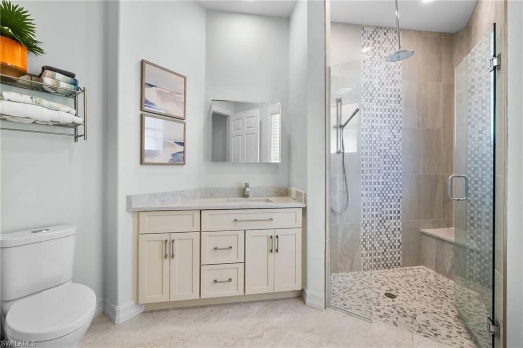20196 Markward Crossing Estero, FL 33928 - Photo 22 of 42 a bathroom with a sink a toilet and shower