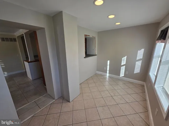 a view of an empty room with a fireplace