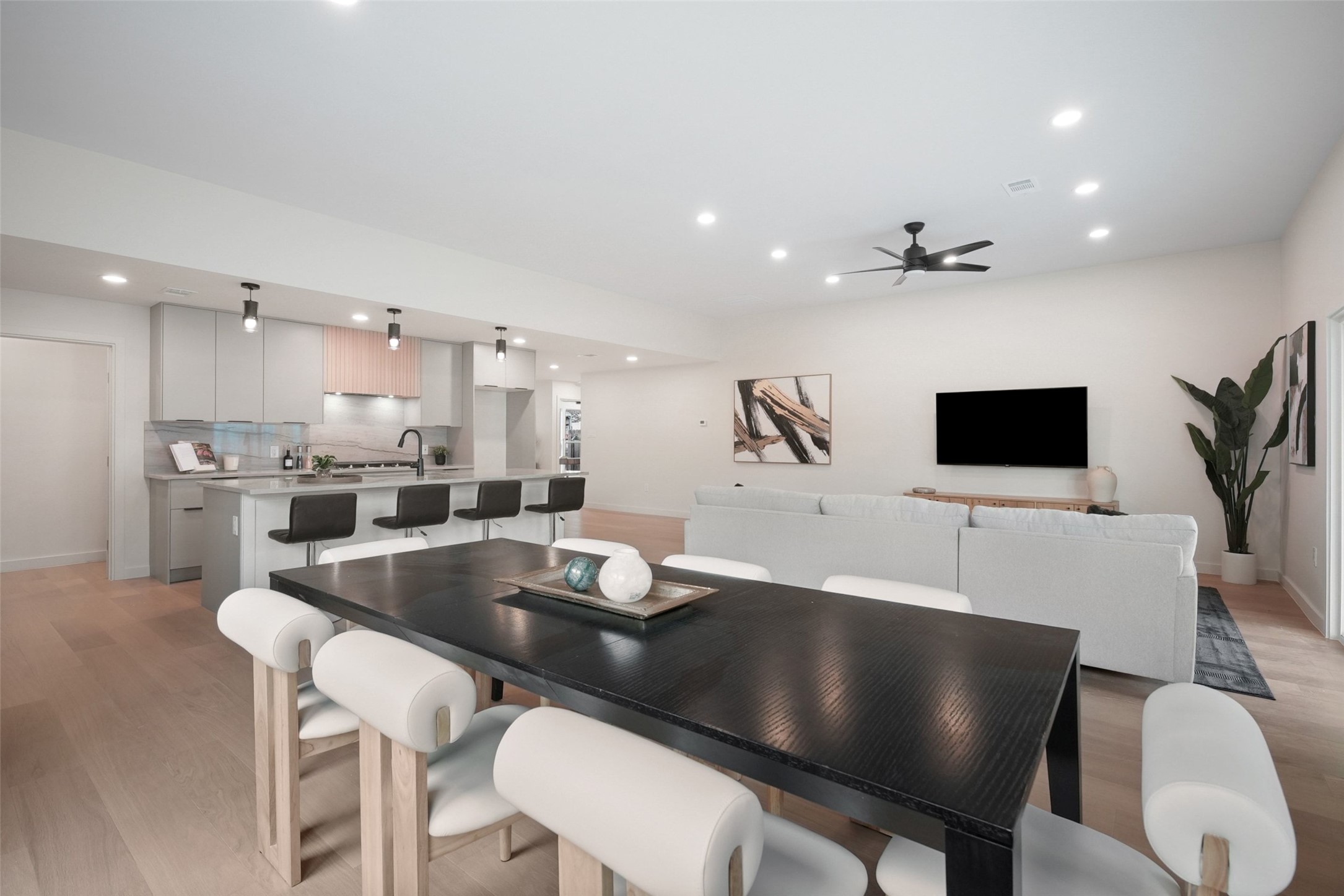 6307 Clubway Lane Austin, TX 78745 - Photo 13 of 34 a kitchen with a dining table chairs and white cabinets