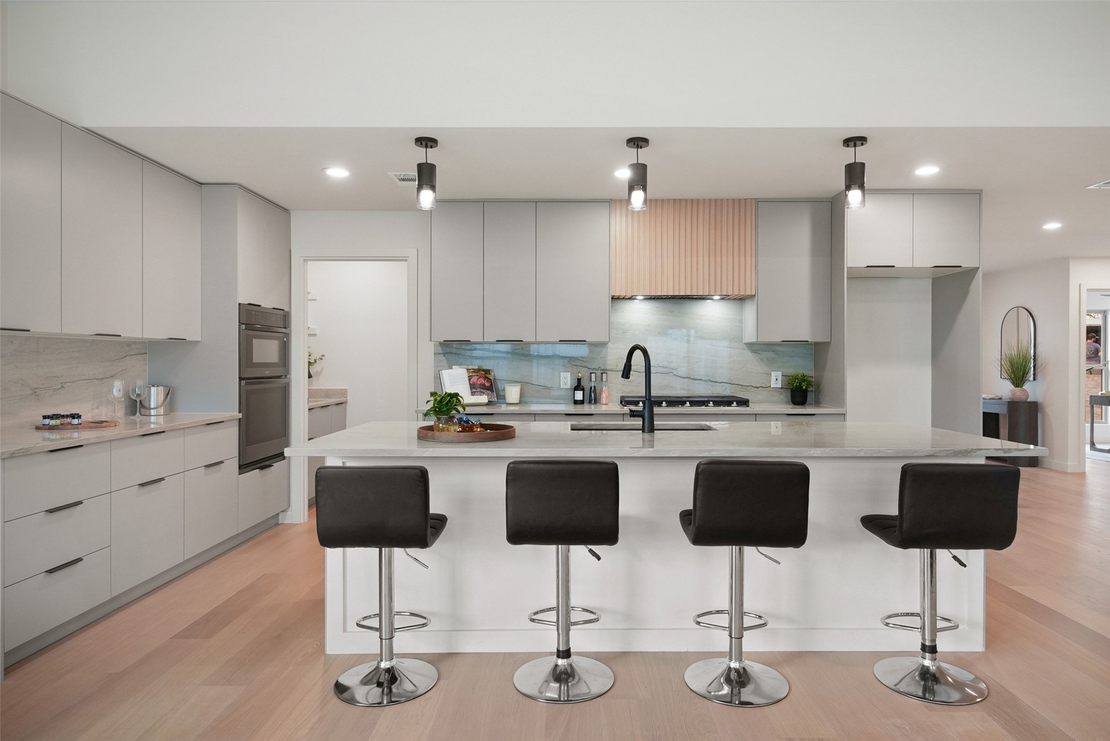 6307 Clubway Lane Austin, TX 78745 - Photo 16 of 34 a kitchen with stainless steel appliances kitchen island granite countertop a dining table chairs and granite counter tops