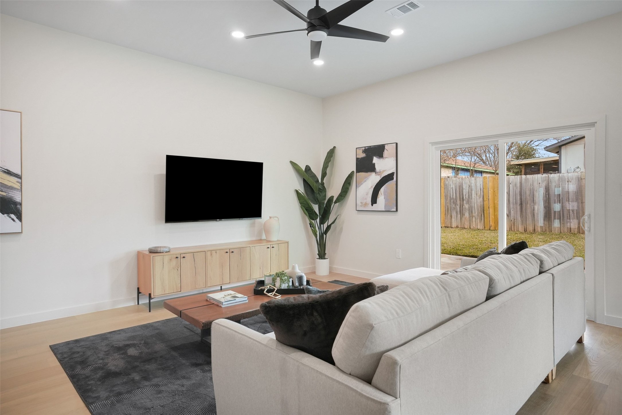6307 Clubway Lane Austin, TX 78745 - Photo 17 of 34 a living room with furniture and a flat screen tv