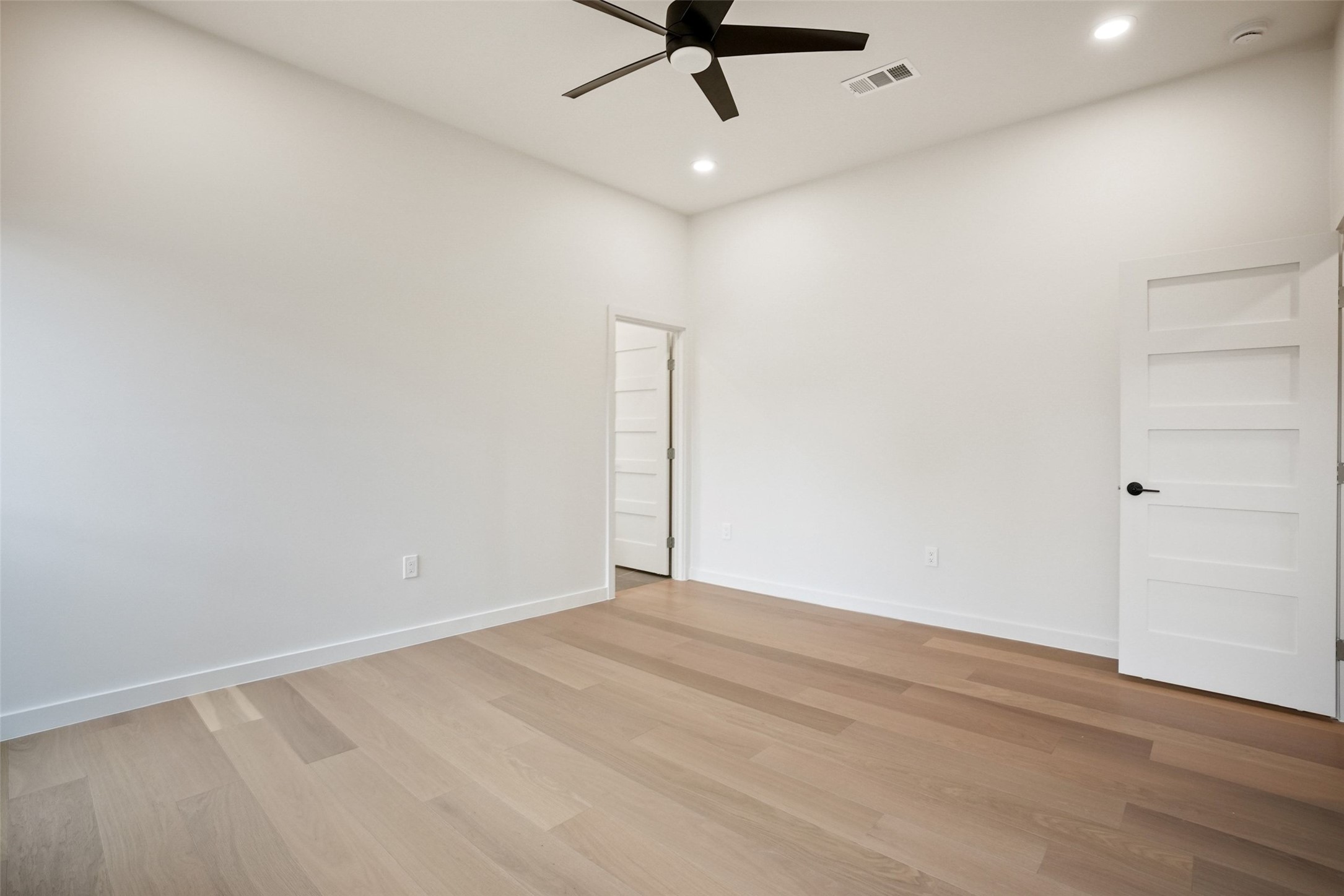 6307 Clubway Lane Austin, TX 78745 - Photo 21 of 34 an empty room with a ceiling fan and carpet