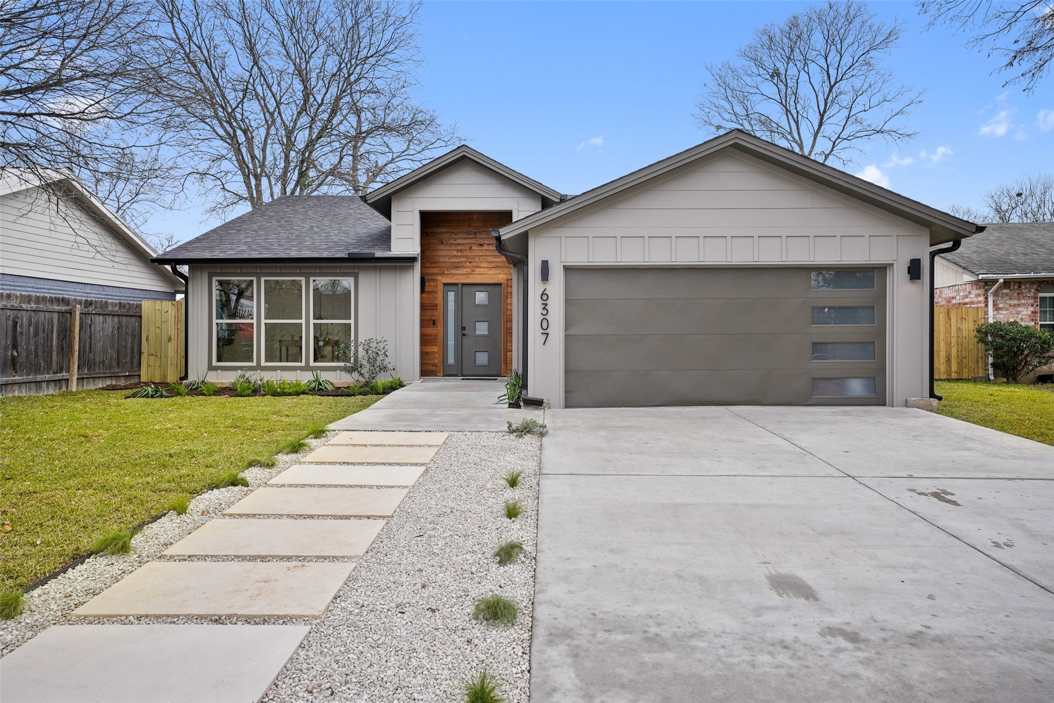 6307 Clubway Lane Austin, TX 78745 - Photo 3 of 34 front view of a house with a yard