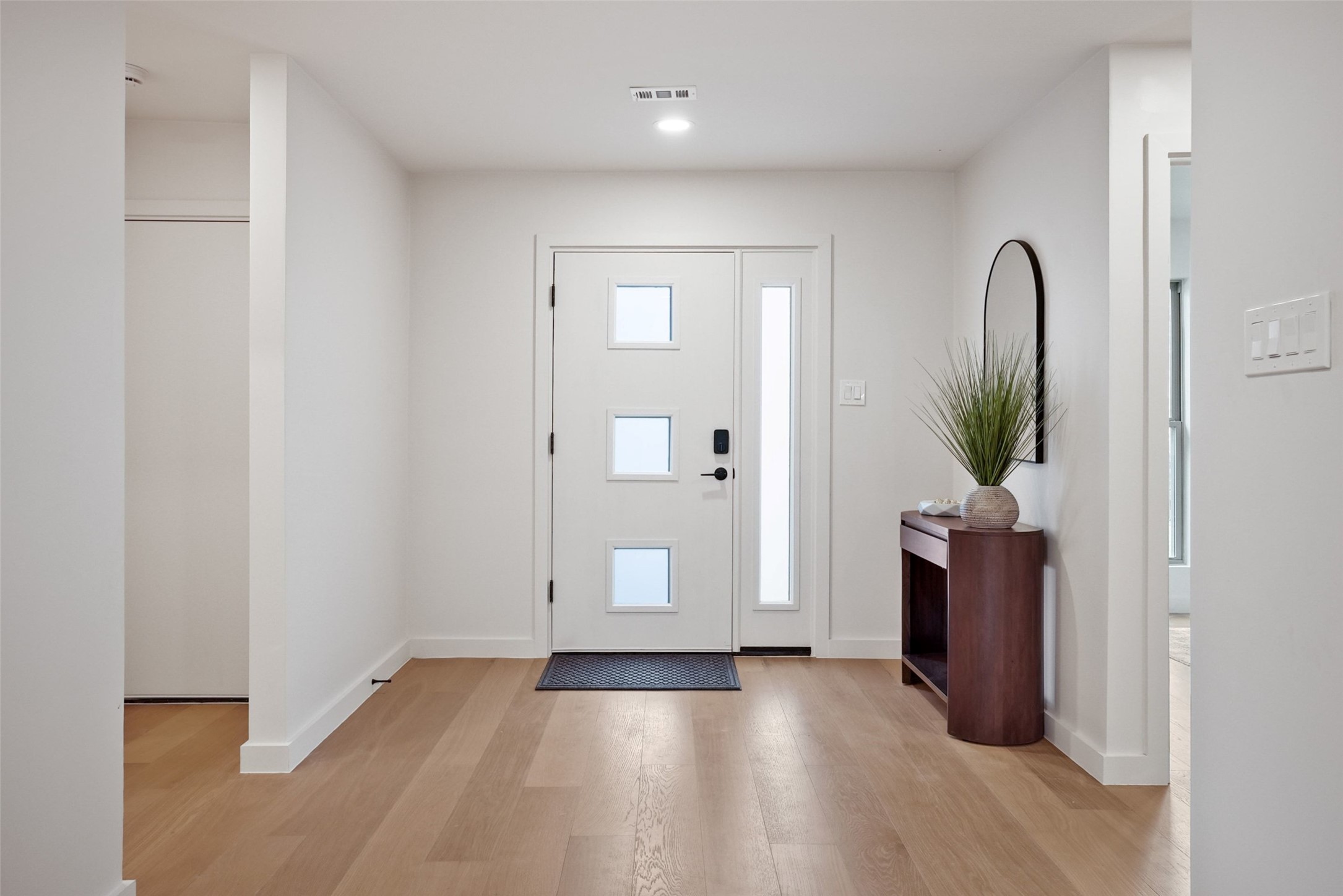 6307 Clubway Lane Austin, TX 78745 - Photo 5 of 34 wooden floor in a hall with an entryway
