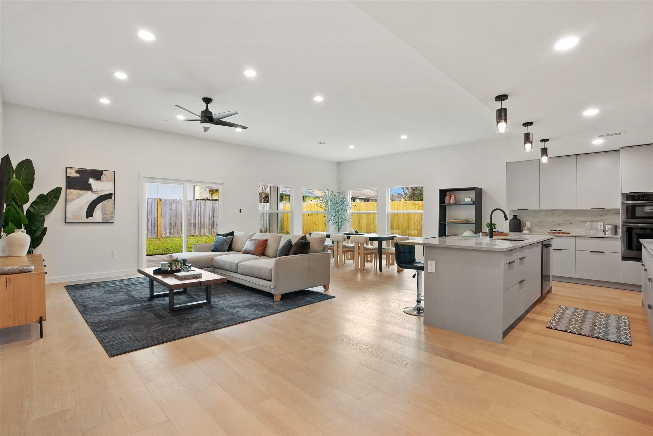 6307 Clubway Lane Austin, TX 78745 - Photo 7 of 34 a living room with furniture kitchen view and a potted plant