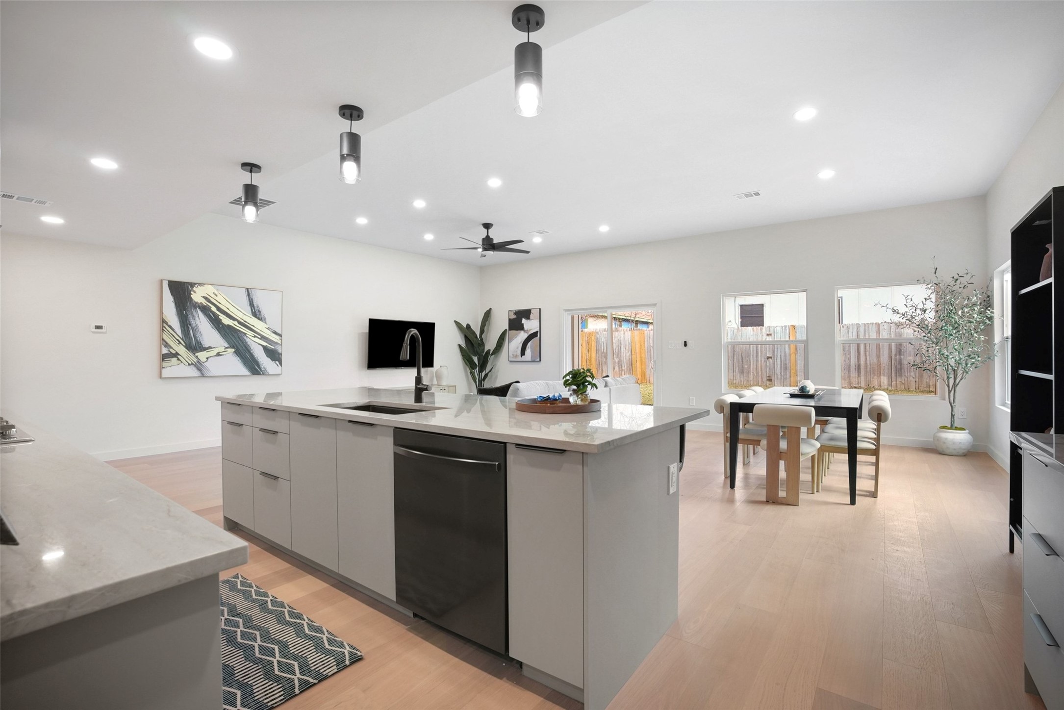 6307 Clubway Lane Austin, TX 78745 - Photo 10 of 34 a view of living room with granite countertop furniture a flat screen tv and a stove