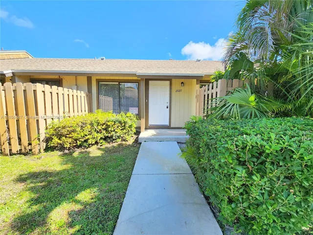 a view of a house with garden