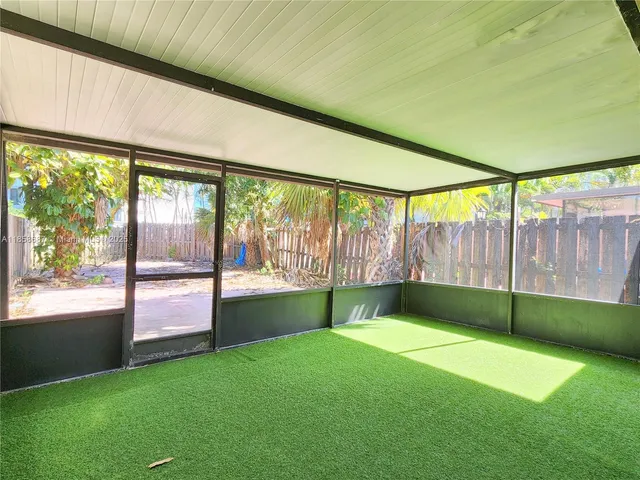 a view of an empty room with a window and an outdoor view