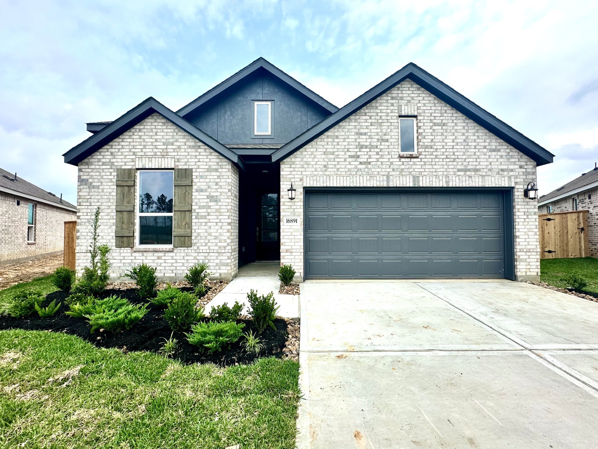 9303 Captain Terrace Drive Baytown, TX 77521 - Photo 1 of 28 a view of small house with a yard and potted plants