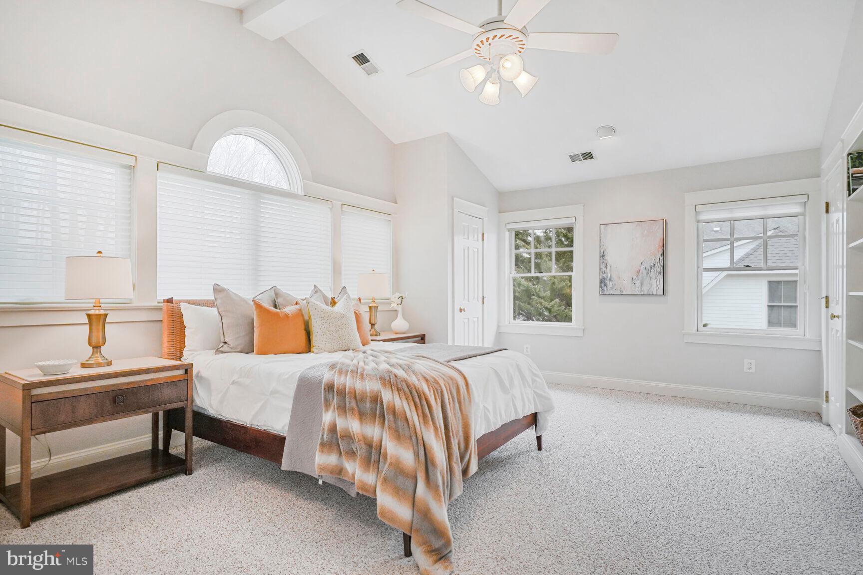2012 Rockingham Street McLean, VA 22101 - Photo 20 of 45 a spacious bedroom with a bed and a chandelier