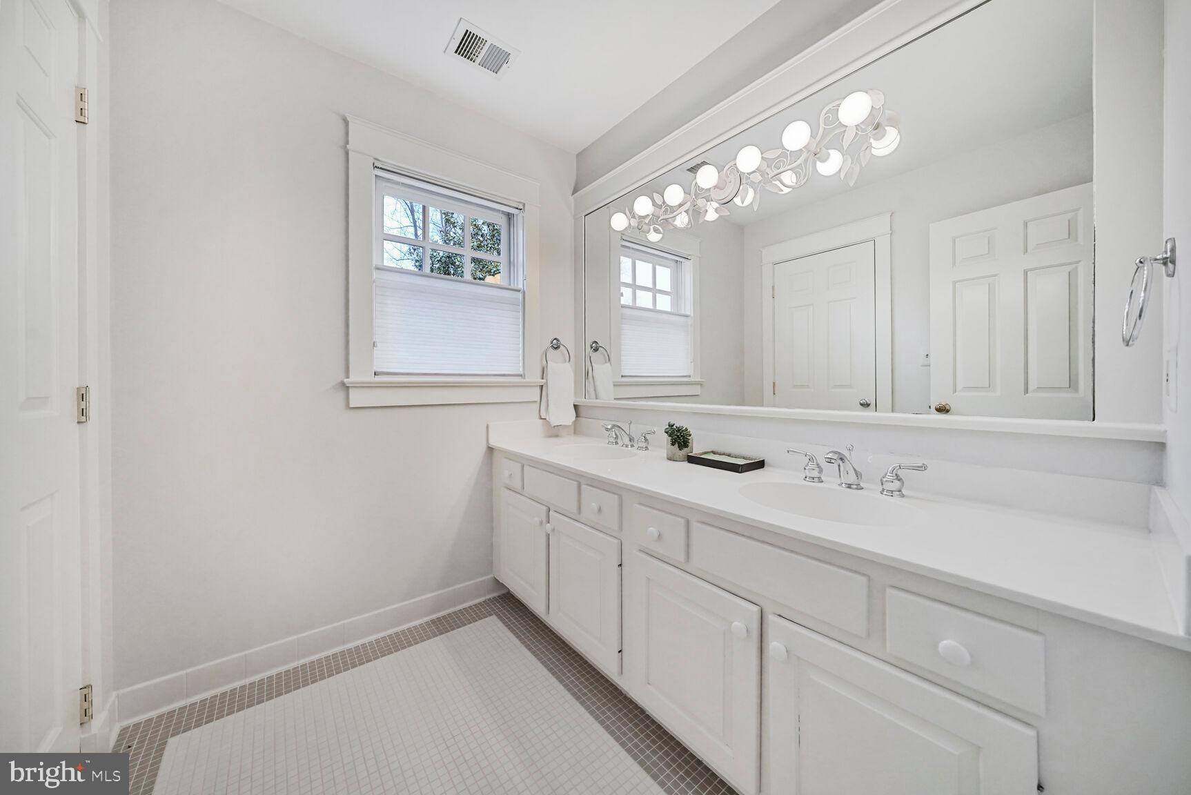 2012 Rockingham Street McLean, VA 22101 - Photo 25 of 45 a bathroom with 2 sink and a mirror