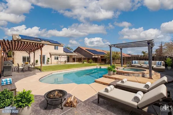 a view of a house with swimming pool and porch with furniture