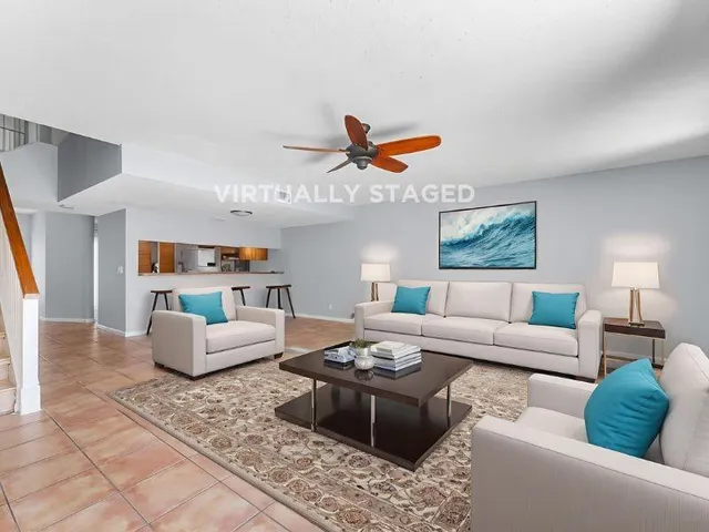 a bedroom with a large bed and a flat screen tv