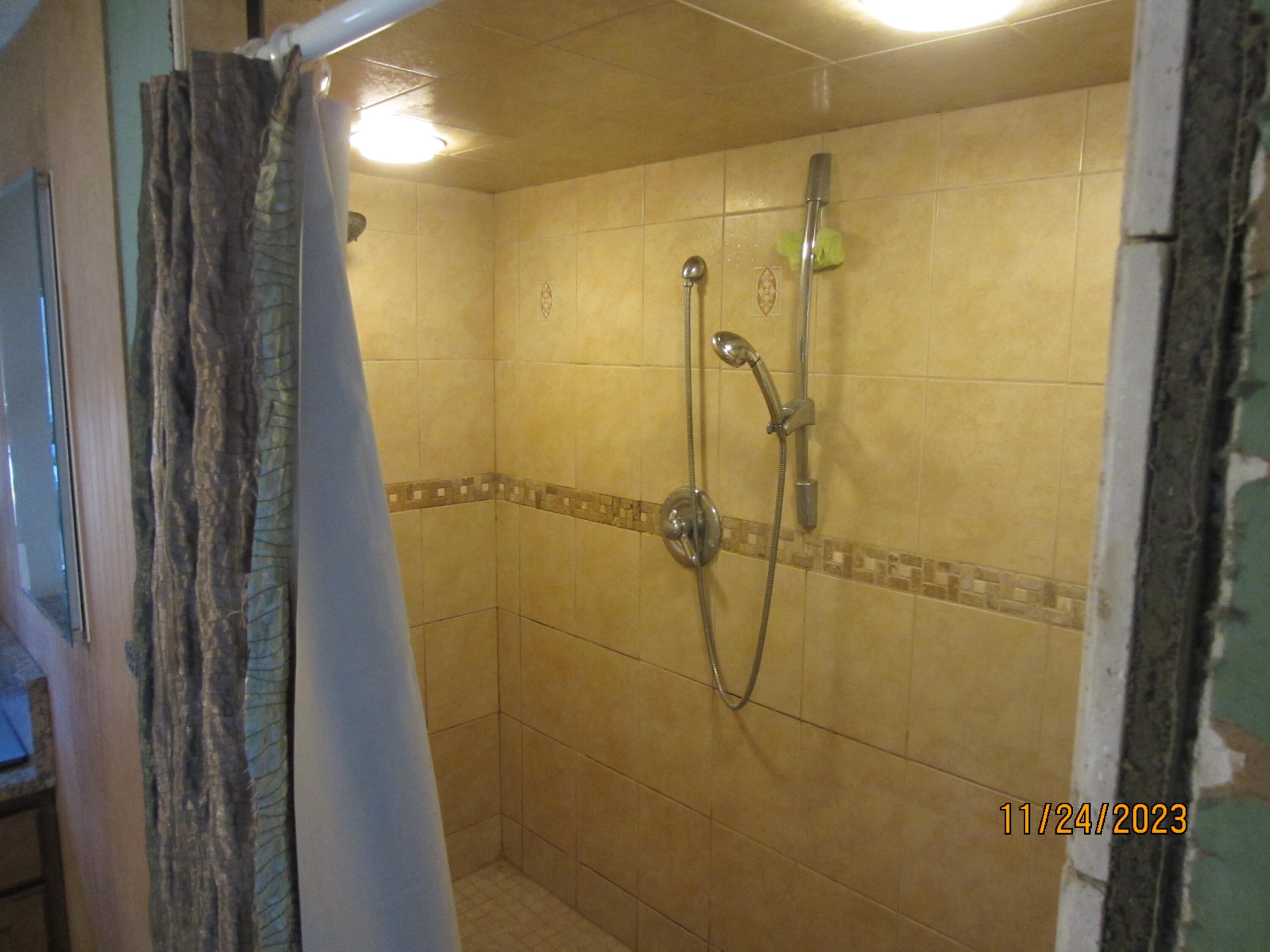 133 4th Street Santa Rosa Beach, FL 32459 - Photo 10 of 13 a bathroom with a shower