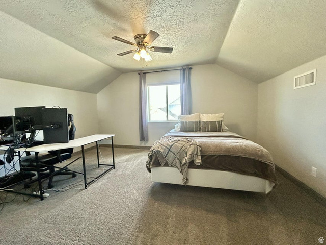 310 625 East Enterprise, UT 84725 - Photo 35 of 36 Vaulted ceiling with a ceiling fan, carpeted flooring, and a window with curtains
