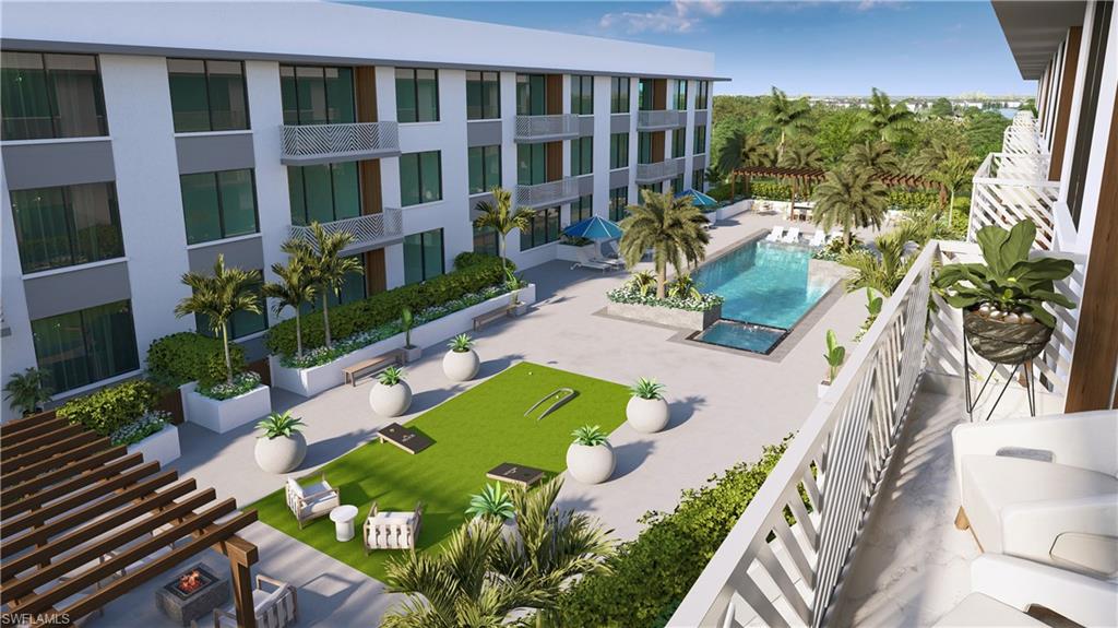 4936 Tamiami Trail East, Unit 310 Naples, FL 34113 - Photo 5 of 8 a view of a house with backyard