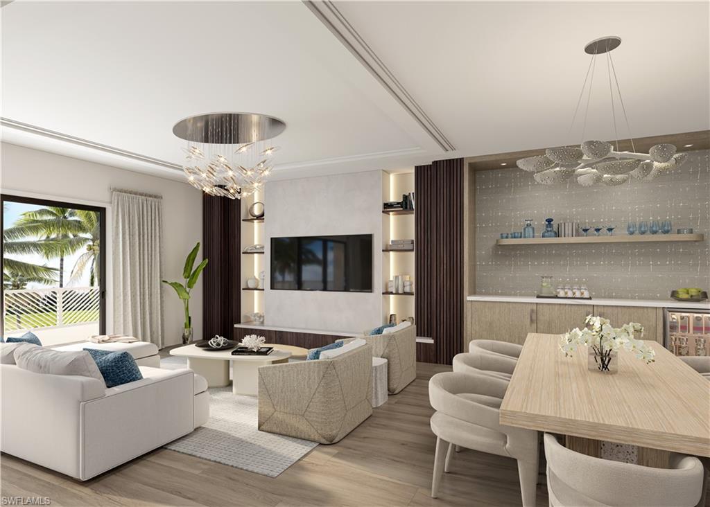 4936 Tamiami Trail East, Unit 310 Naples, FL 34113 - Photo 6 of 8 a living room with furniture and a flat screen tv