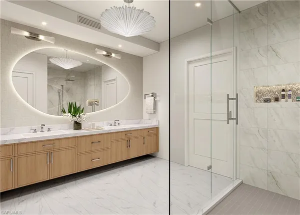 a bathroom with a double vanity sink mirror and shower