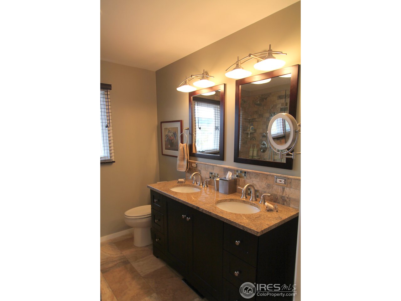 411 High Court Fort Collins, CO 80521 - Photo 13 of 25 a bathroom with a sink and a mirror