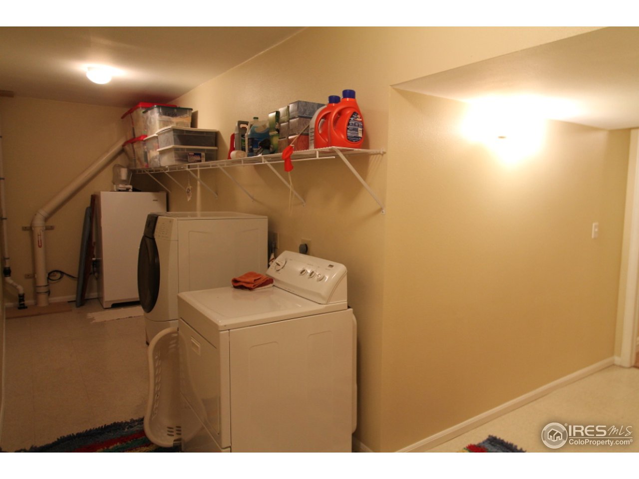 411 High Court Fort Collins, CO 80521 - Photo 20 of 25 a view of storage and utility room with washer and dryer