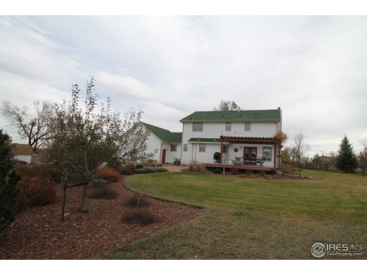 411 High Court Fort Collins, CO 80521 - Photo 25 of 25 a big house with a big yard and large trees
