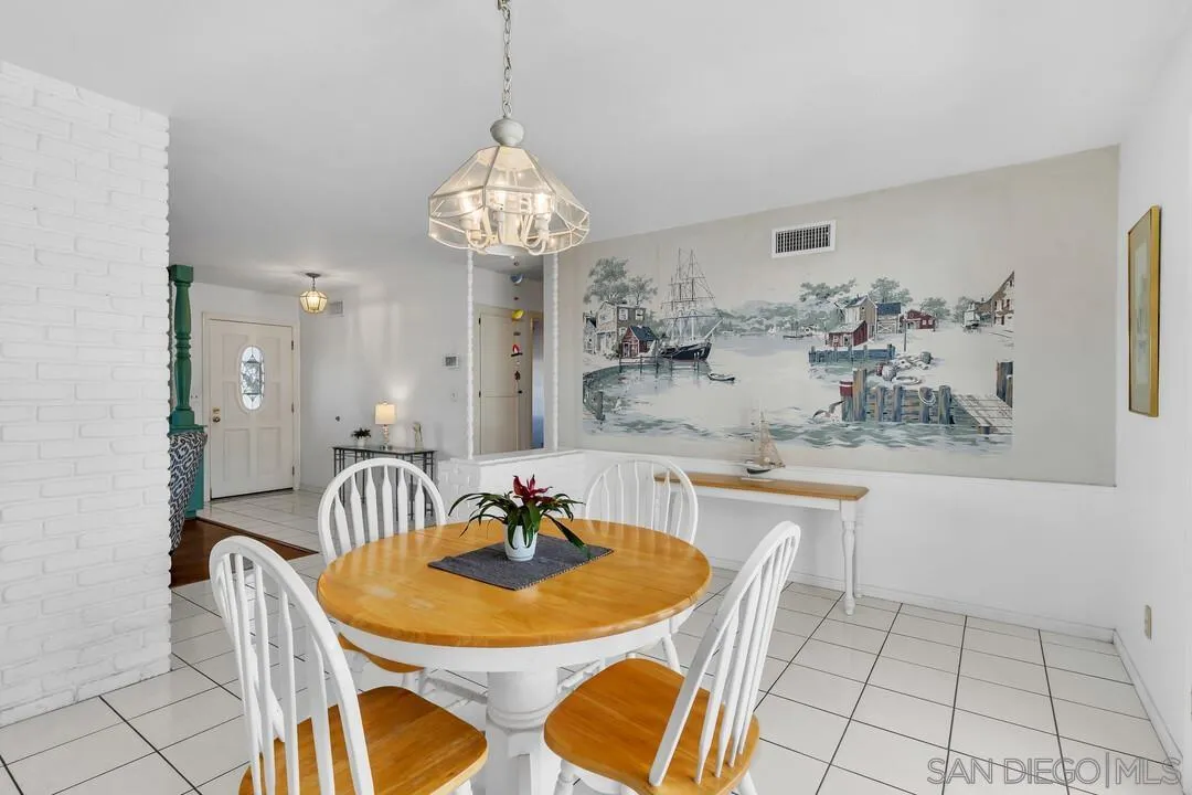 9326 Oakbourne Road Santee, CA 92071 - Photo 11 of 41 a view of a dining room and a chandelier