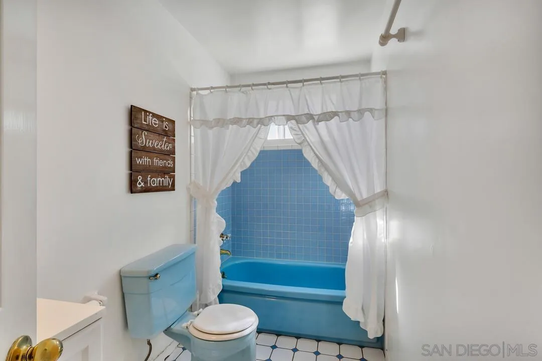 9326 Oakbourne Road Santee, CA 92071 - Photo 14 of 41 a bathroom with a toilet and a shower