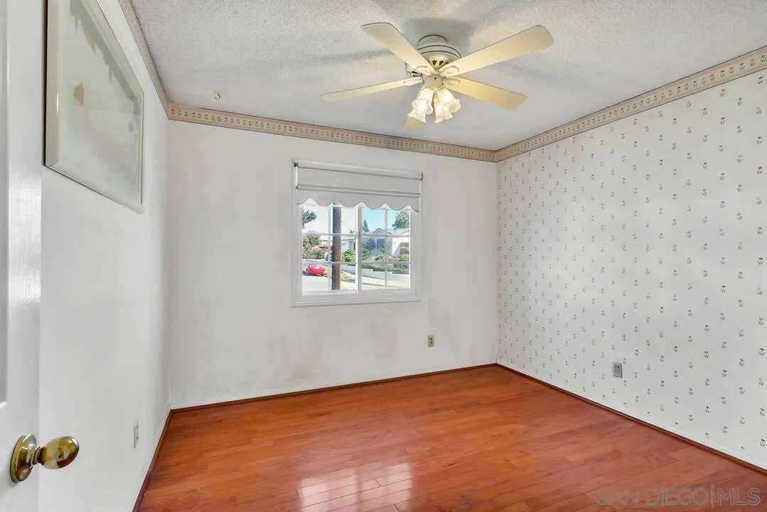 9326 Oakbourne Road Santee, CA 92071 - Photo 15 of 41 an empty room with windows and fan