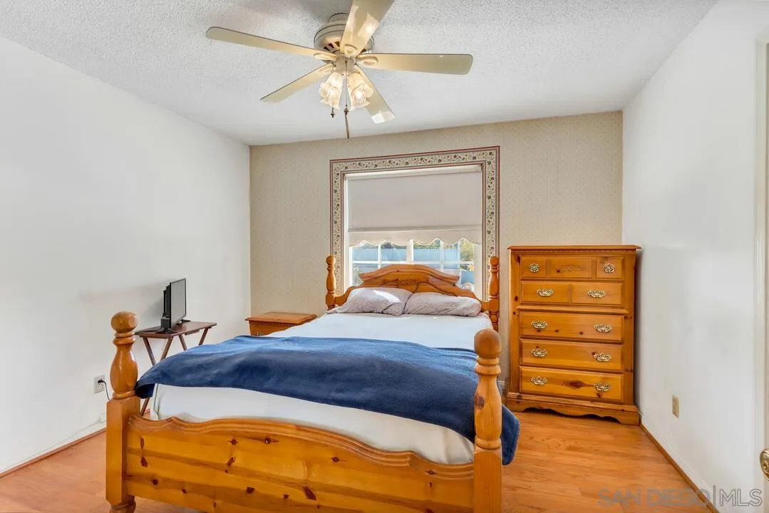 9326 Oakbourne Road Santee, CA 92071 - Photo 17 of 41 a bedroom with a bed and a closet