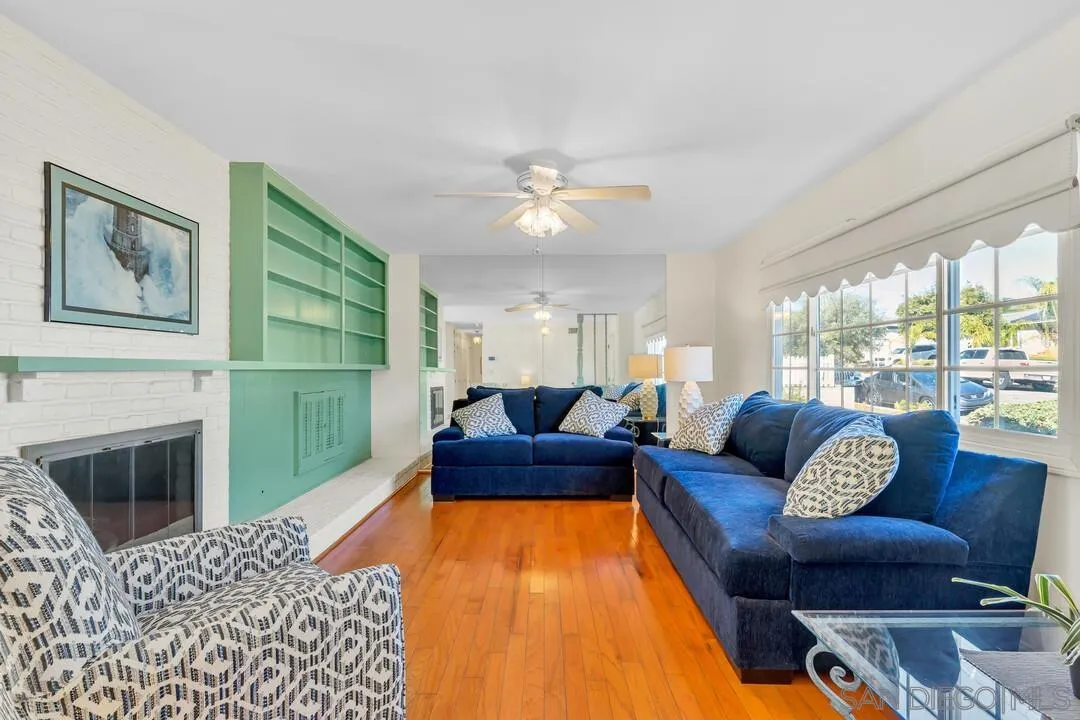 9326 Oakbourne Road Santee, CA 92071 - Photo 2 of 41 a living room with furniture and a fireplace