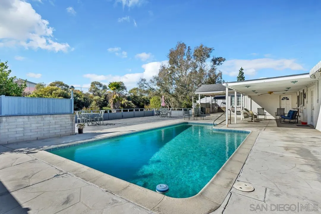9326 Oakbourne Road Santee, CA 92071 - Photo 25 of 41 a view of a swimming pool with a lounge chairs