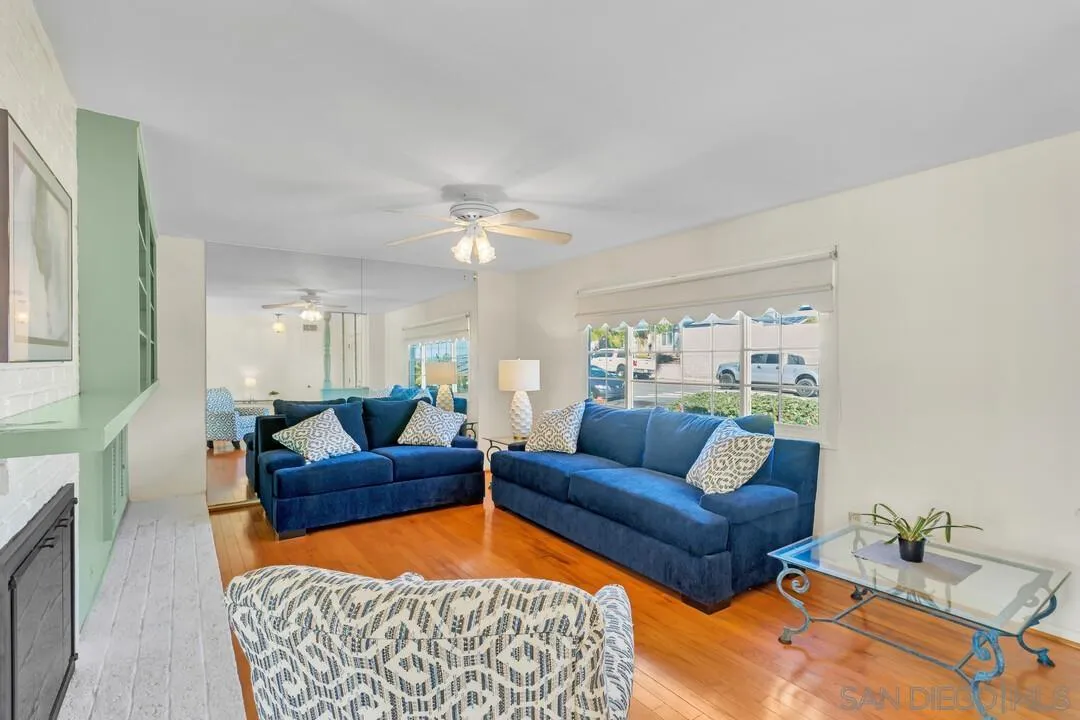 9326 Oakbourne Road Santee, CA 92071 - Photo 3 of 41 a living room with furniture a rug and a chandelier