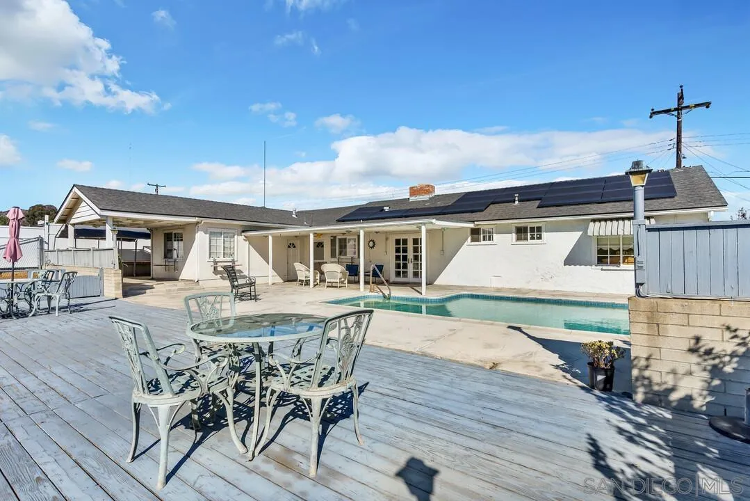 9326 Oakbourne Road Santee, CA 92071 - Photo 31 of 41 a view of a patio with table and chairs with wooden floor and fence