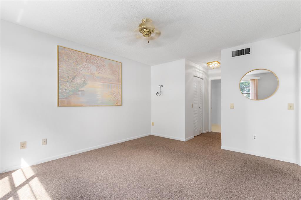 9676 West McNab Road, Unit 110 Fort Lauderdale, FL 33321 - Photo 13 of 26 a view of an empty room with a window