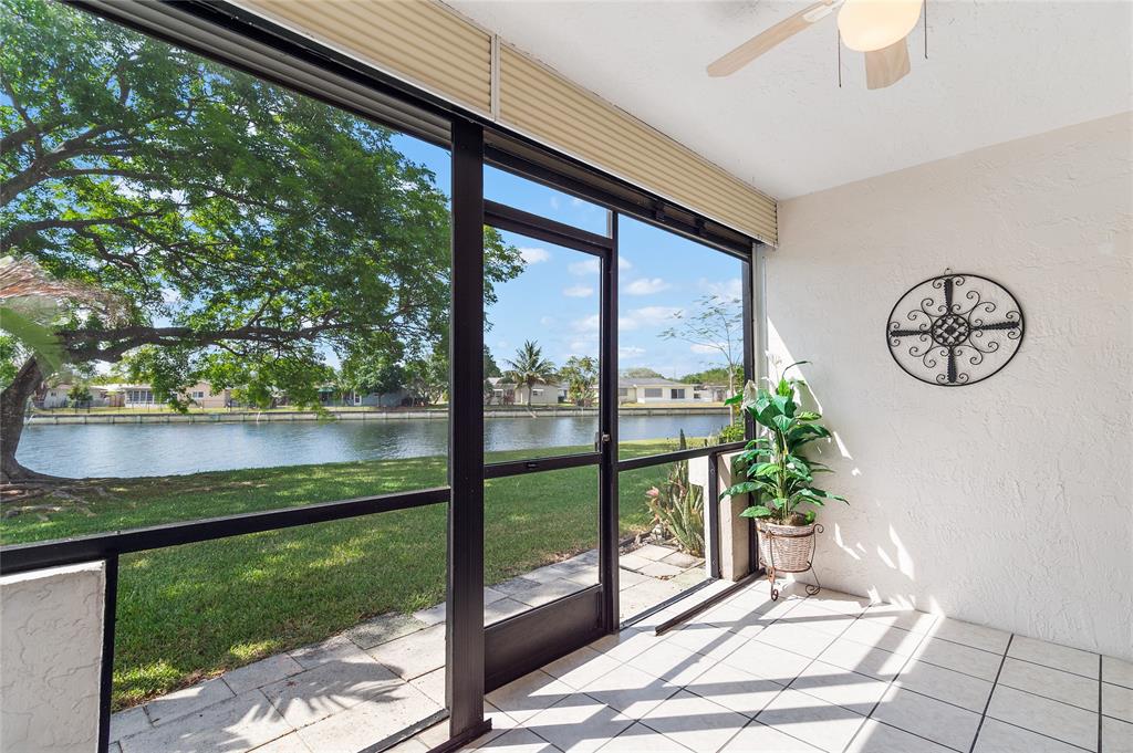 9676 West McNab Road, Unit 110 Fort Lauderdale, FL 33321 - Photo 19 of 26 a view of a floor to ceiling window in a yard