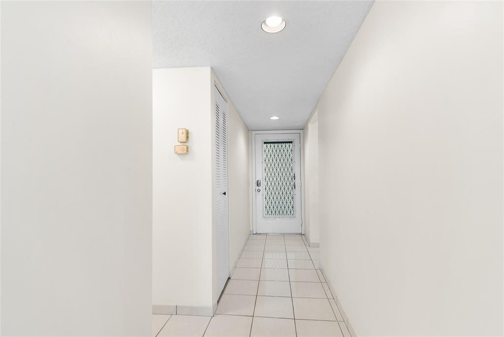 9676 West McNab Road, Unit 110 Fort Lauderdale, FL 33321 - Photo 2 of 26 a view of a hallway