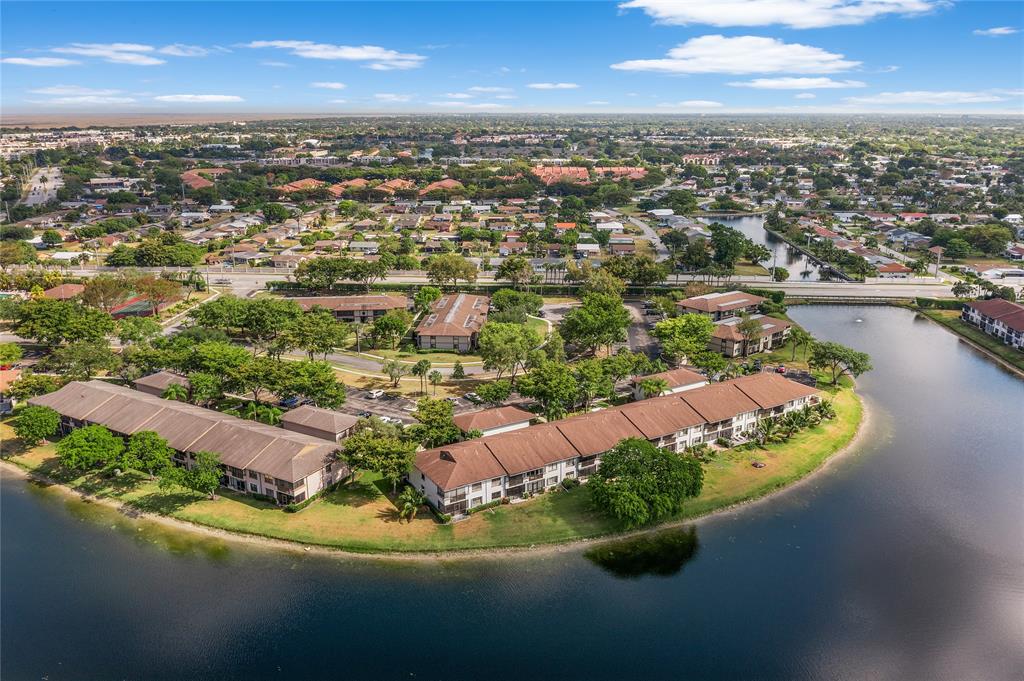 9676 West McNab Road, Unit 110 Fort Lauderdale, FL 33321 - Photo 22 of 26 an aerial view of a house with a lake view
