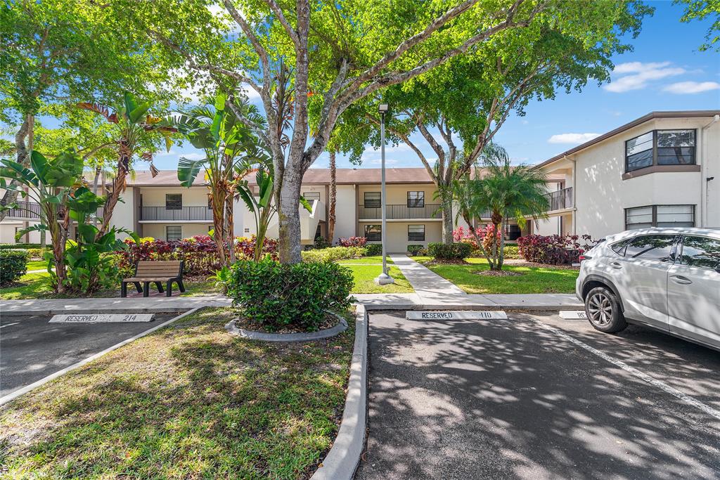 9676 West McNab Road, Unit 110 Fort Lauderdale, FL 33321 - Photo 26 of 26 a house view with a garden space