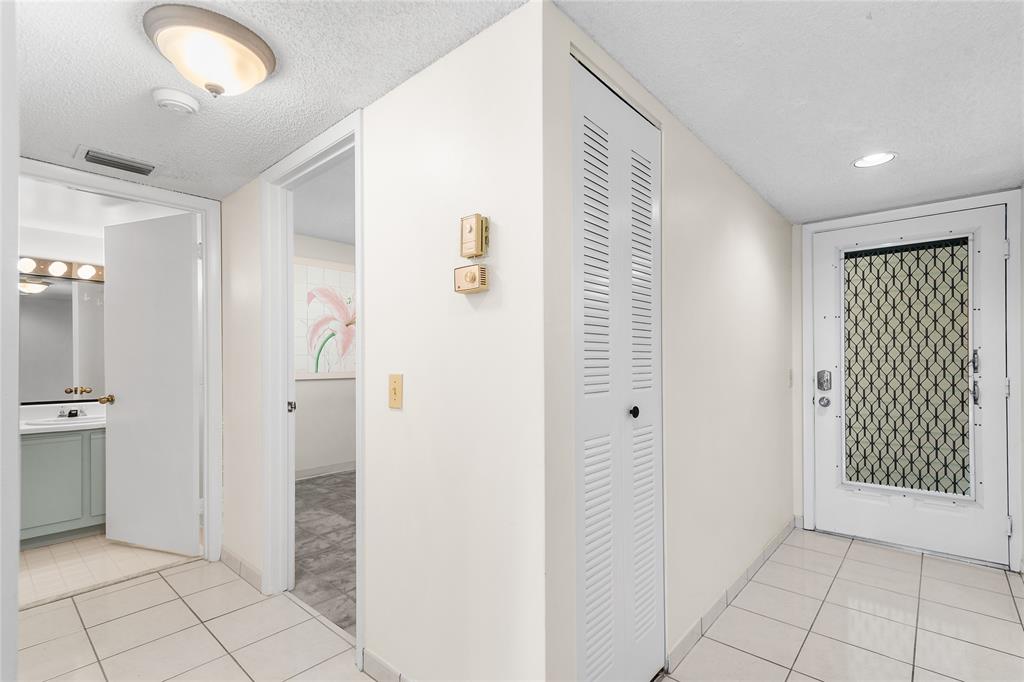 9676 West McNab Road, Unit 110 Fort Lauderdale, FL 33321 - Photo 6 of 26 a view of a hallway with closet and bathroom