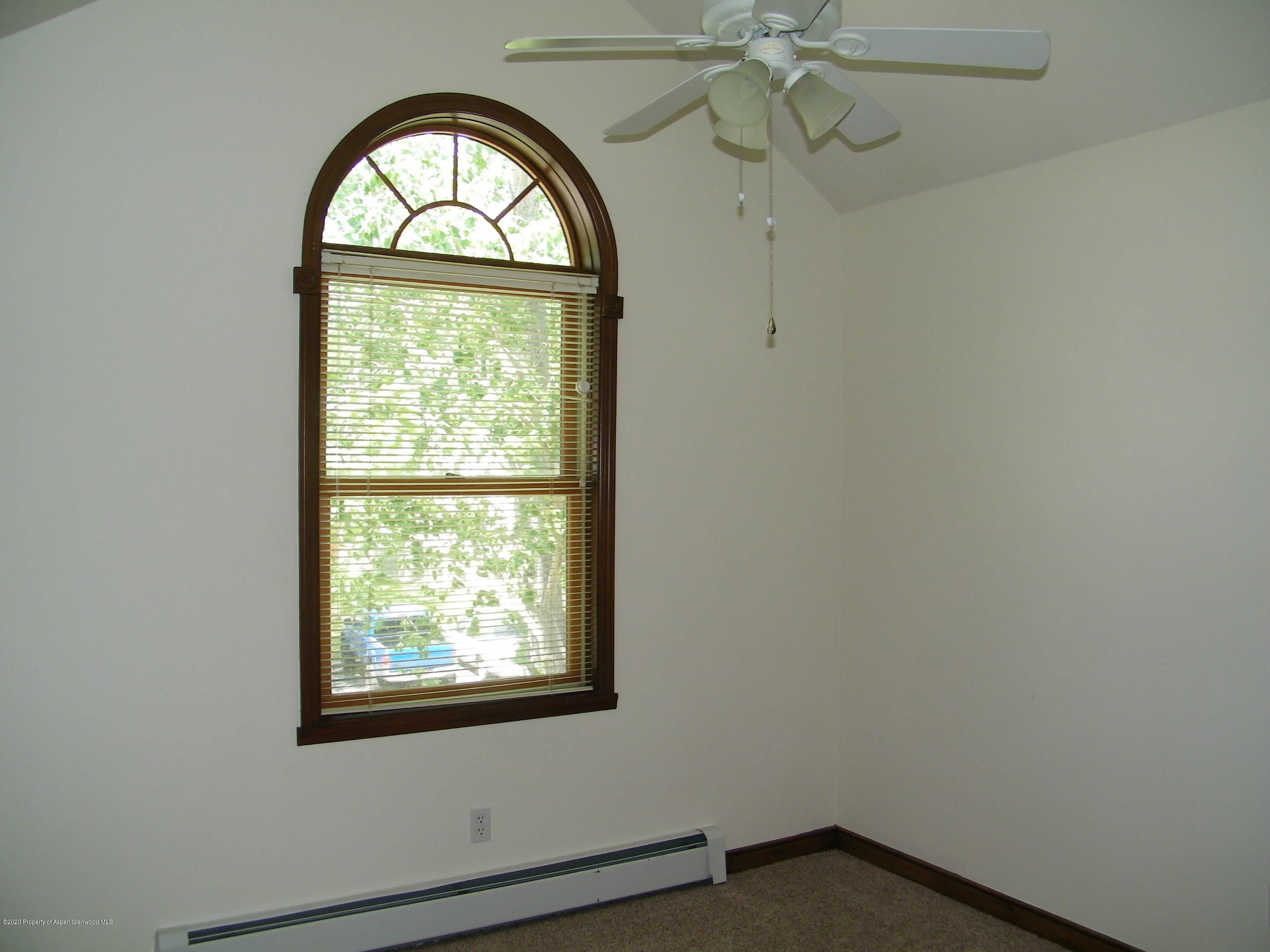 678 Alder Ridge Lane New Castle, CO 81647 - Photo 16 of 18 an empty room with a window and a mirror