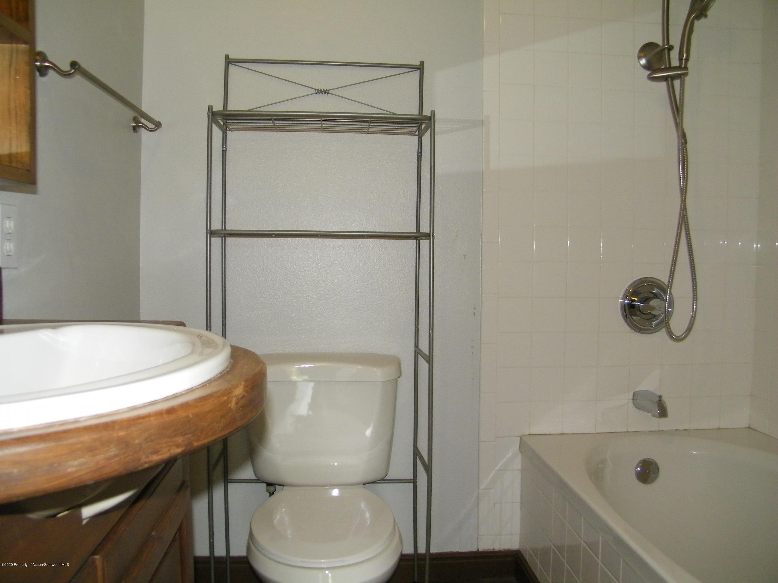 678 Alder Ridge Lane New Castle, CO 81647 - Photo 17 of 18 a bathroom with a sink a toilet and shower
