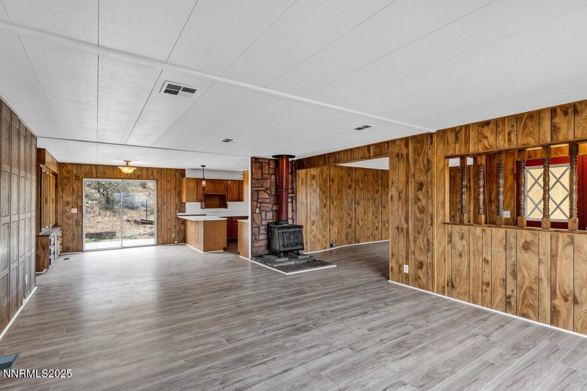 1211 Slate Road Topaz Ranch Estates, NV 89444 - Photo 14 of 30 an empty room with wooden floor and windows