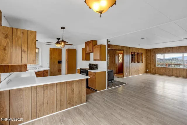 a kitchen with stainless steel appliances granite countertop a stove and a refrigerator