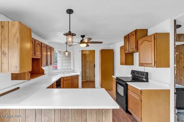 a kitchen with stainless steel appliances granite countertop a stove and cabinets