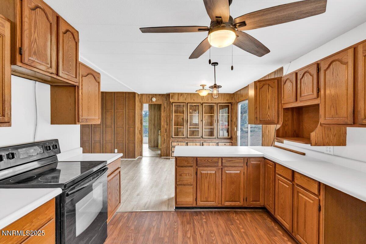 1211 Slate Road Topaz Ranch Estates, NV 89444 - Photo 20 of 30 a kitchen with stainless steel appliances granite countertop a stove and cabinets