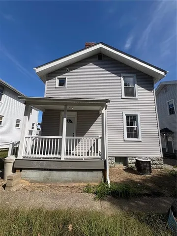a front view of a house with garage