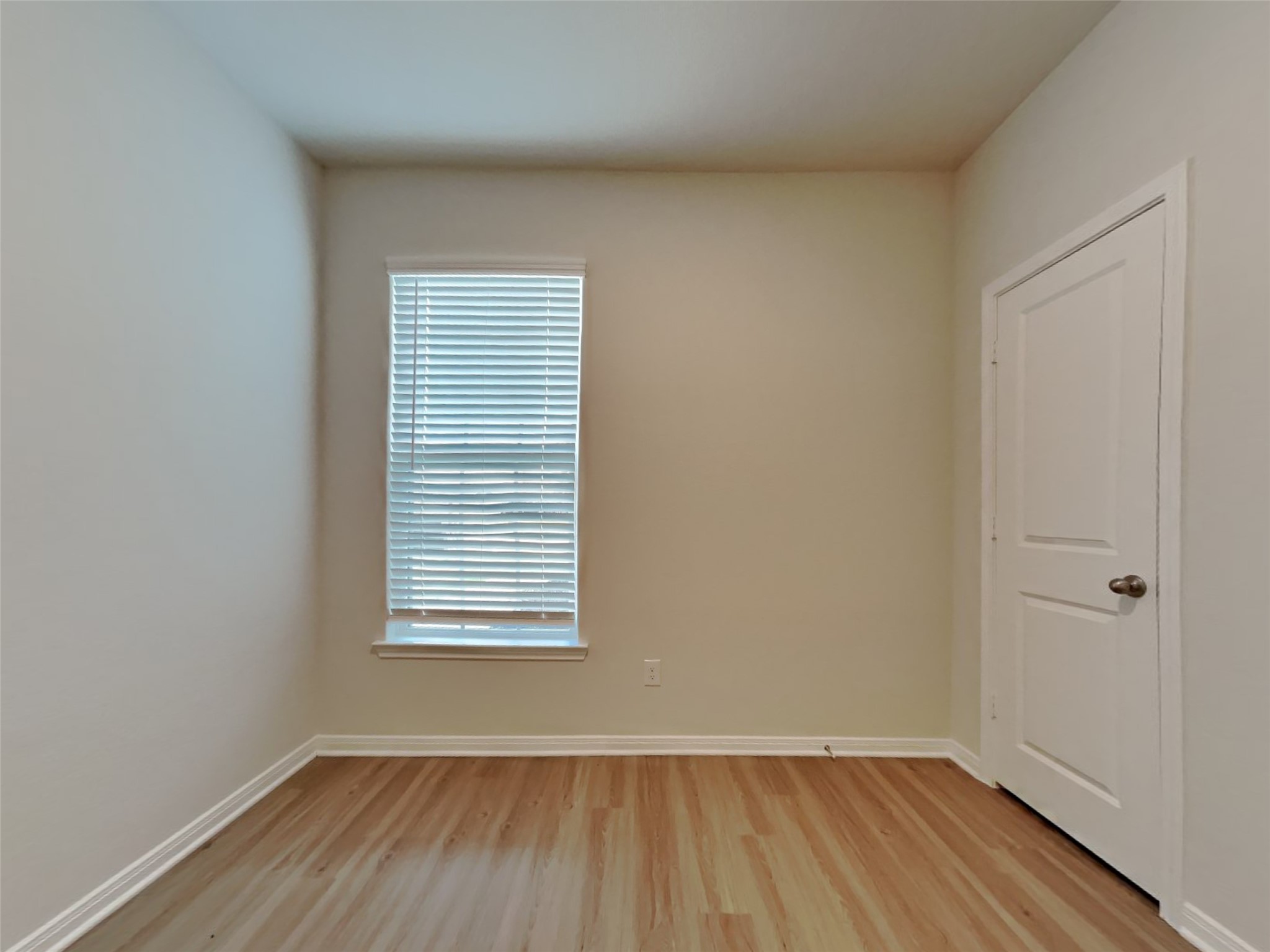 15419 Maple Ter Drive Conroe, TX 77303 - Photo 11 of 26 a view of a room that has wooden floor and a window