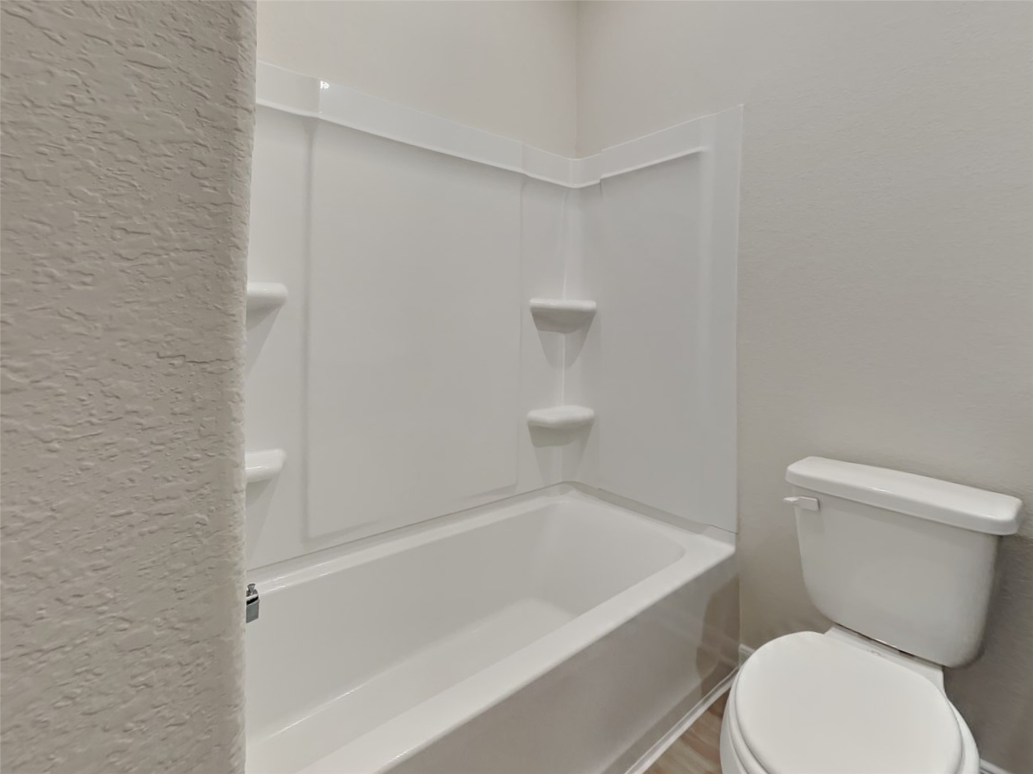 15419 Maple Ter Drive Conroe, TX 77303 - Photo 13 of 26 a white toilet sitting next to a bath tub
