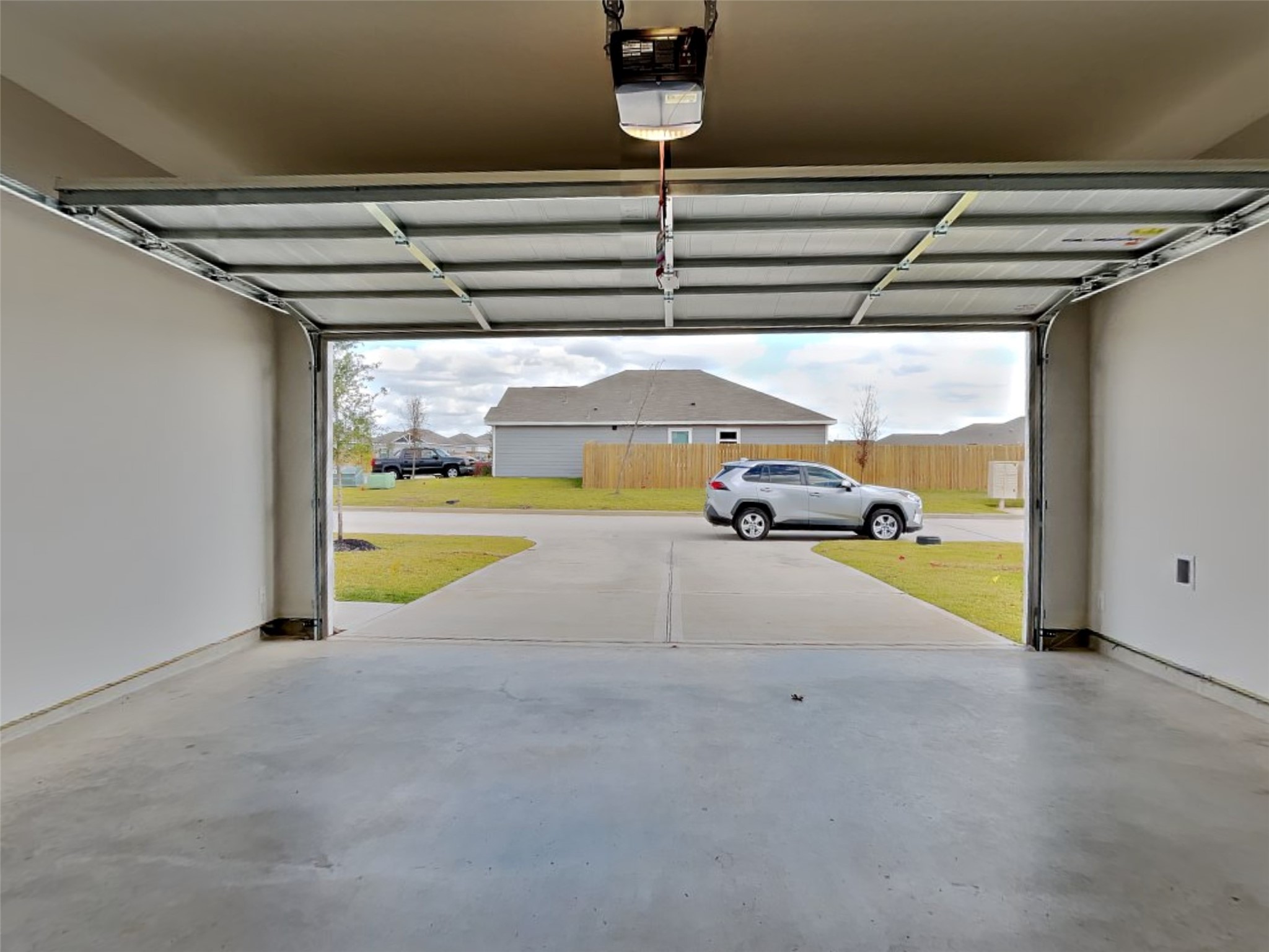 15419 Maple Ter Drive Conroe, TX 77303 - Photo 15 of 26 a view of parking garage with car parked