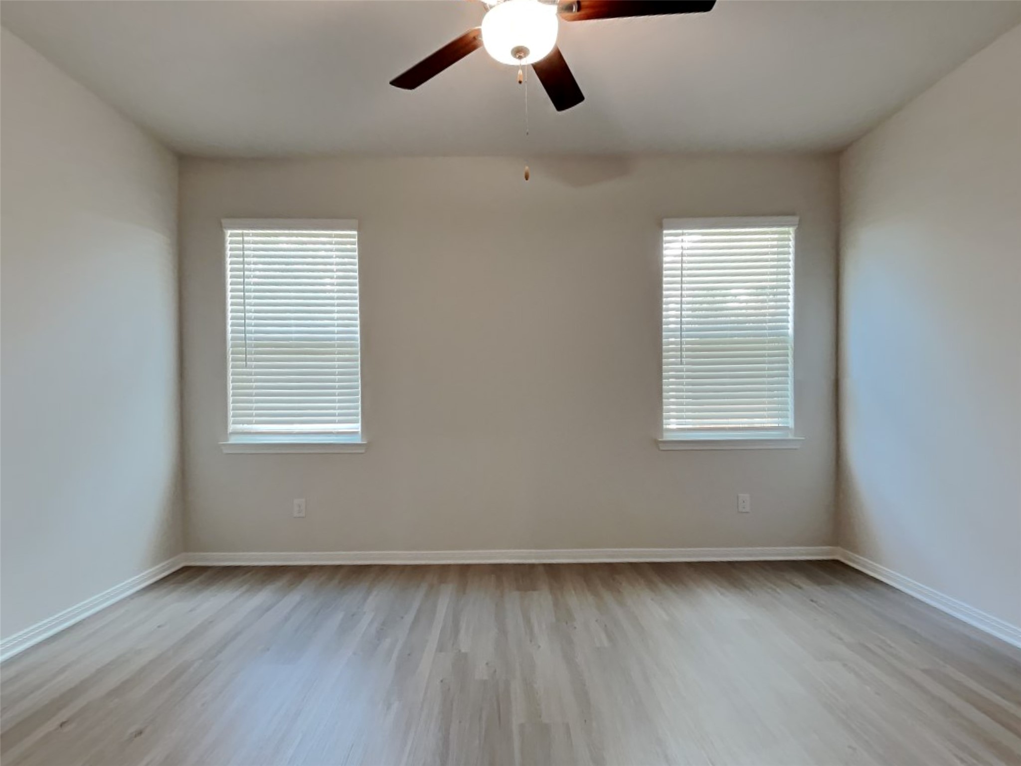 15419 Maple Ter Drive Conroe, TX 77303 - Photo 20 of 26 wooden floor in an empty room with a window